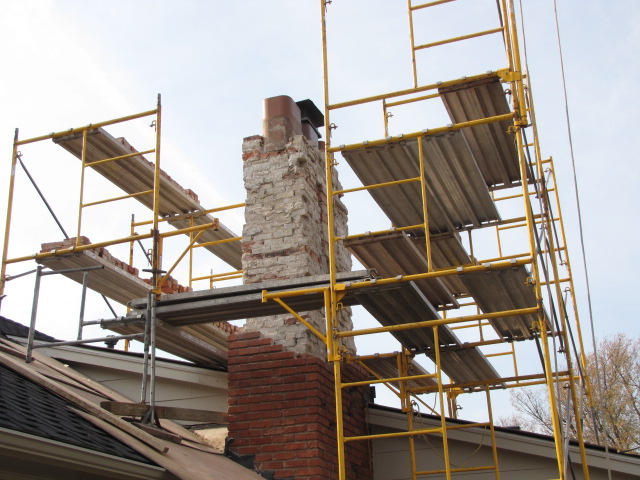 Chimney being repaired to replace bad masonry